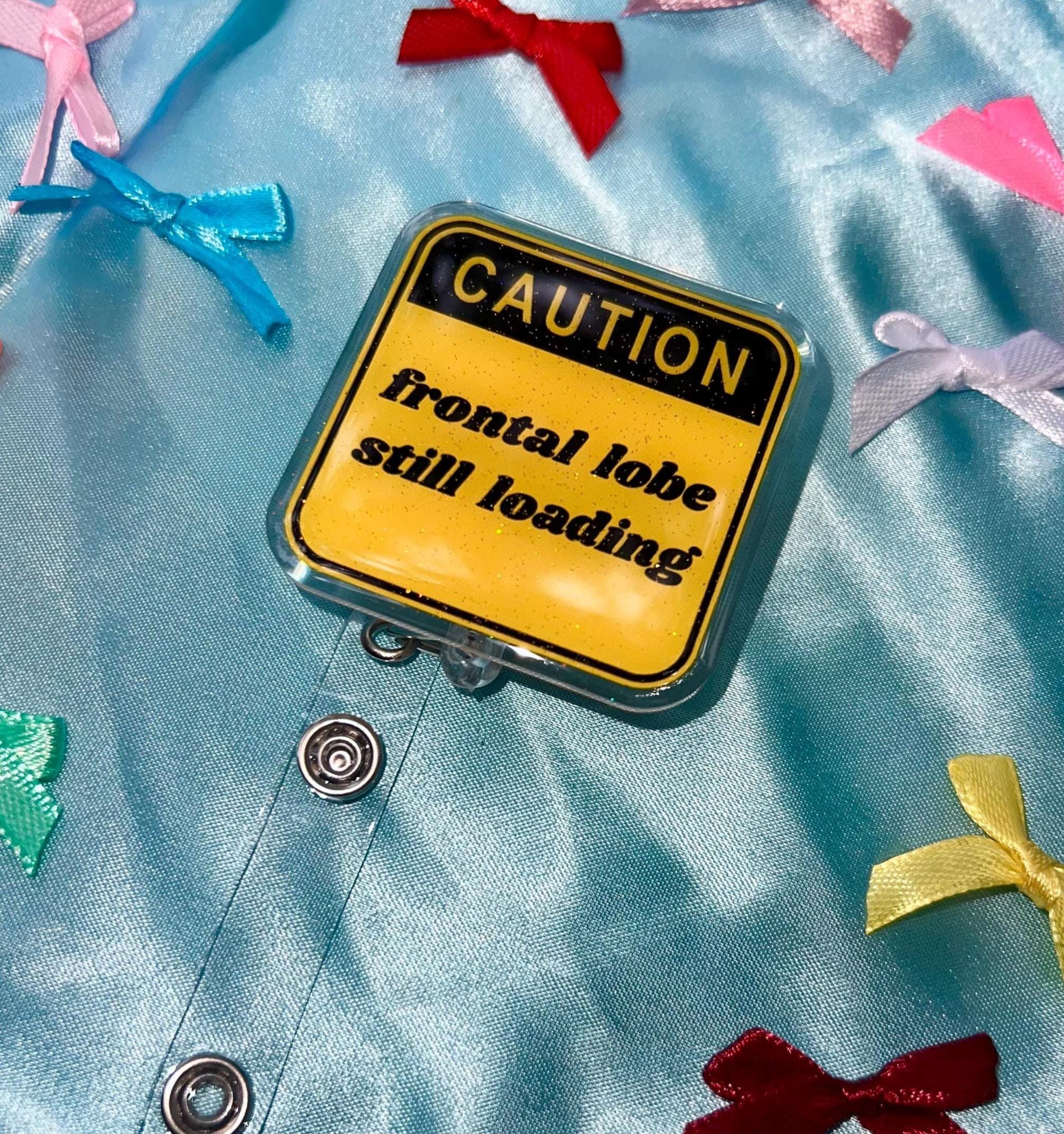 Funny "Frontal Lobe Still Loading" Glitter Badge Reel | Caution Sign Retractable ID Holder for Gen Z Nurses, Students & Teachers