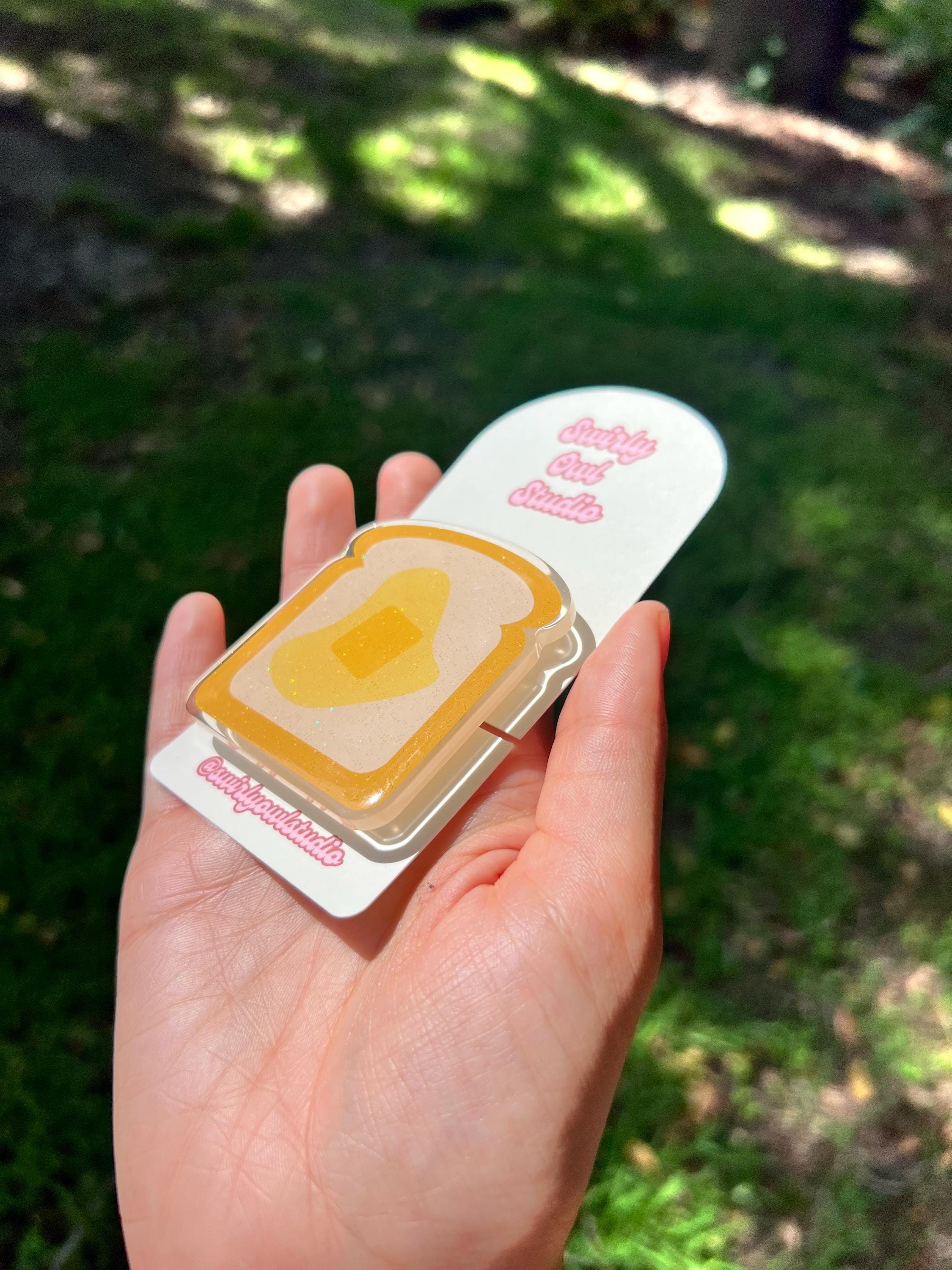 Buttered Toast Glitter Kindle/E-Reader Magnetic Grip - Cute Acrylic Phone Stand - Kawaii Food Phone Holder Gift for Bookish Lovers