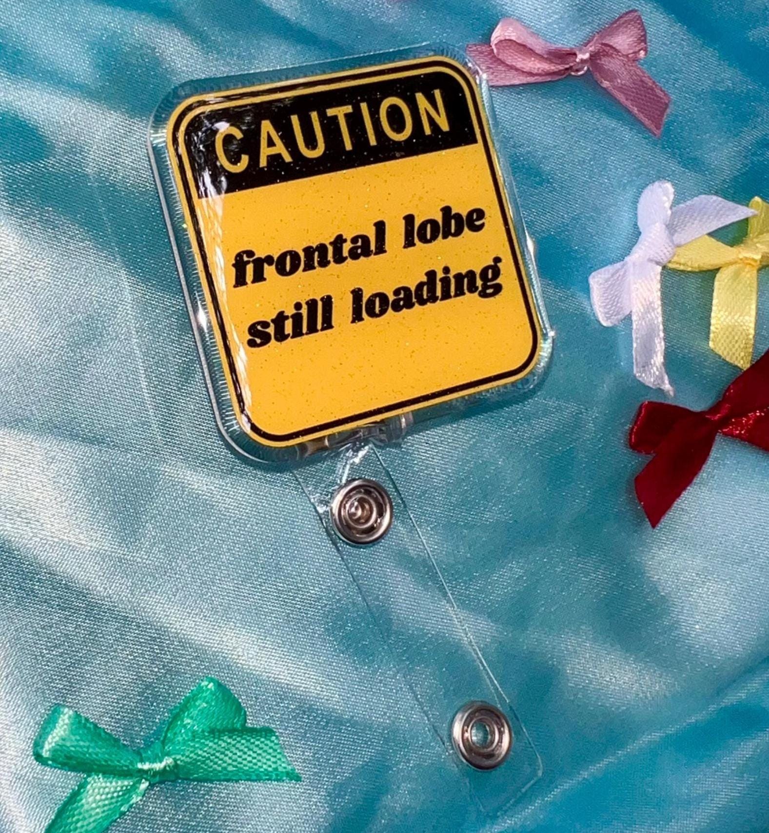 Funny "Frontal Lobe Still Loading" Glitter Badge Reel | Caution Sign Retractable ID Holder for Gen Z Nurses, Students & Teachers