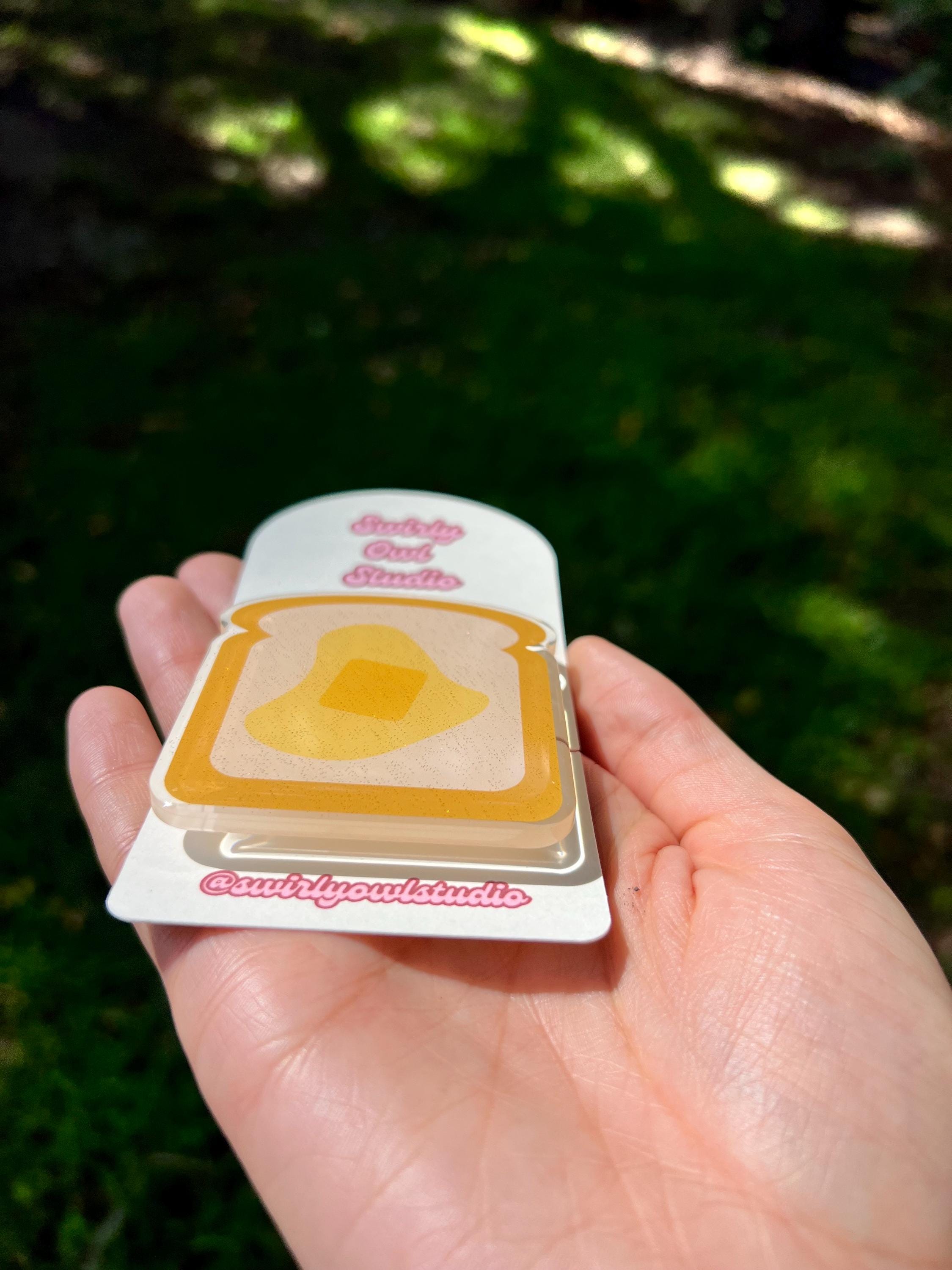 Buttered Toast Glitter Kindle/E-Reader Magnetic Grip - Cute Acrylic Phone Stand - Kawaii Food Phone Holder Gift for Bookish Lovers