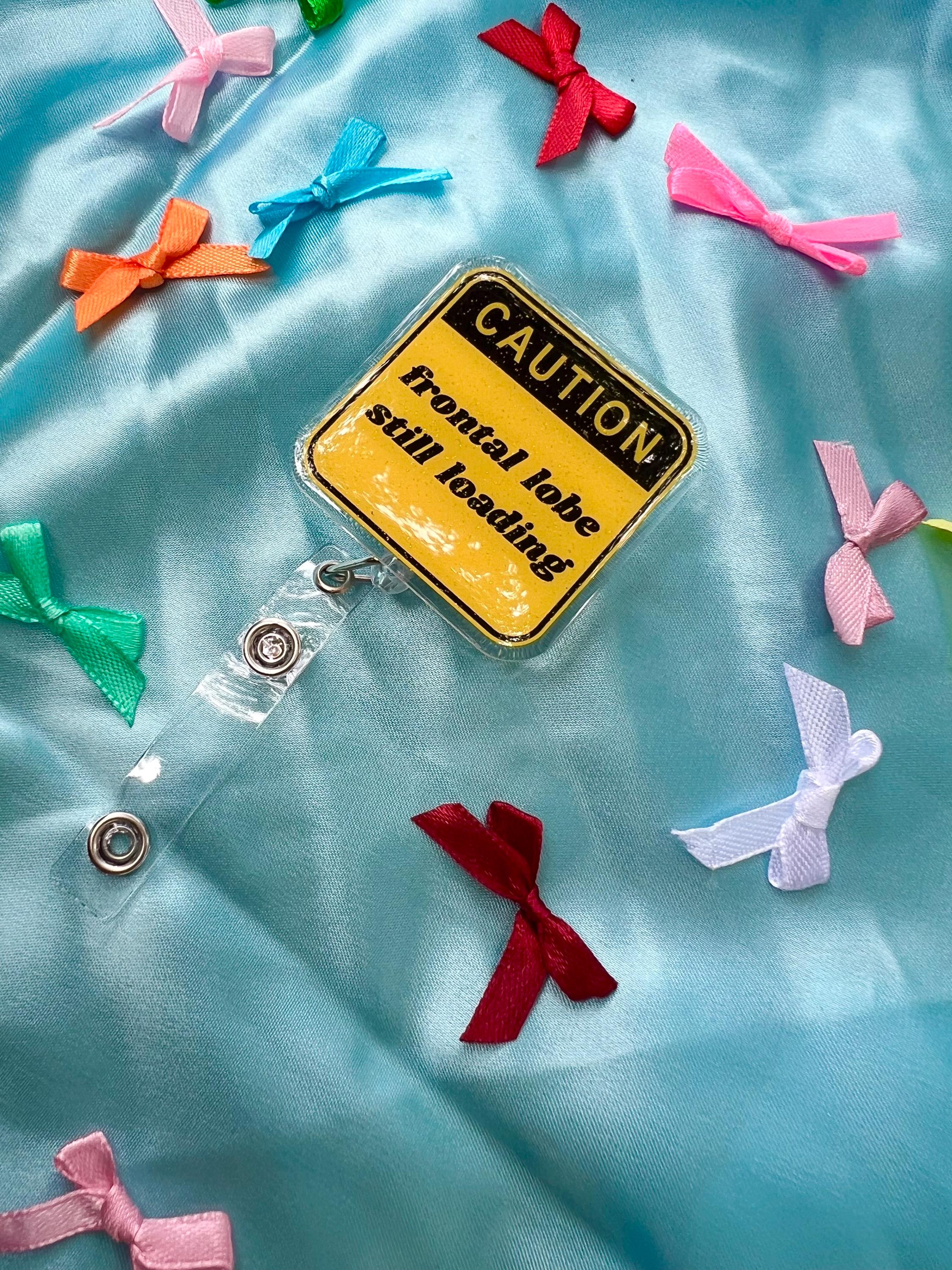 Funny "Frontal Lobe Still Loading" Glitter Badge Reel | Caution Sign Retractable ID Holder for Gen Z Nurses, Students & Teachers