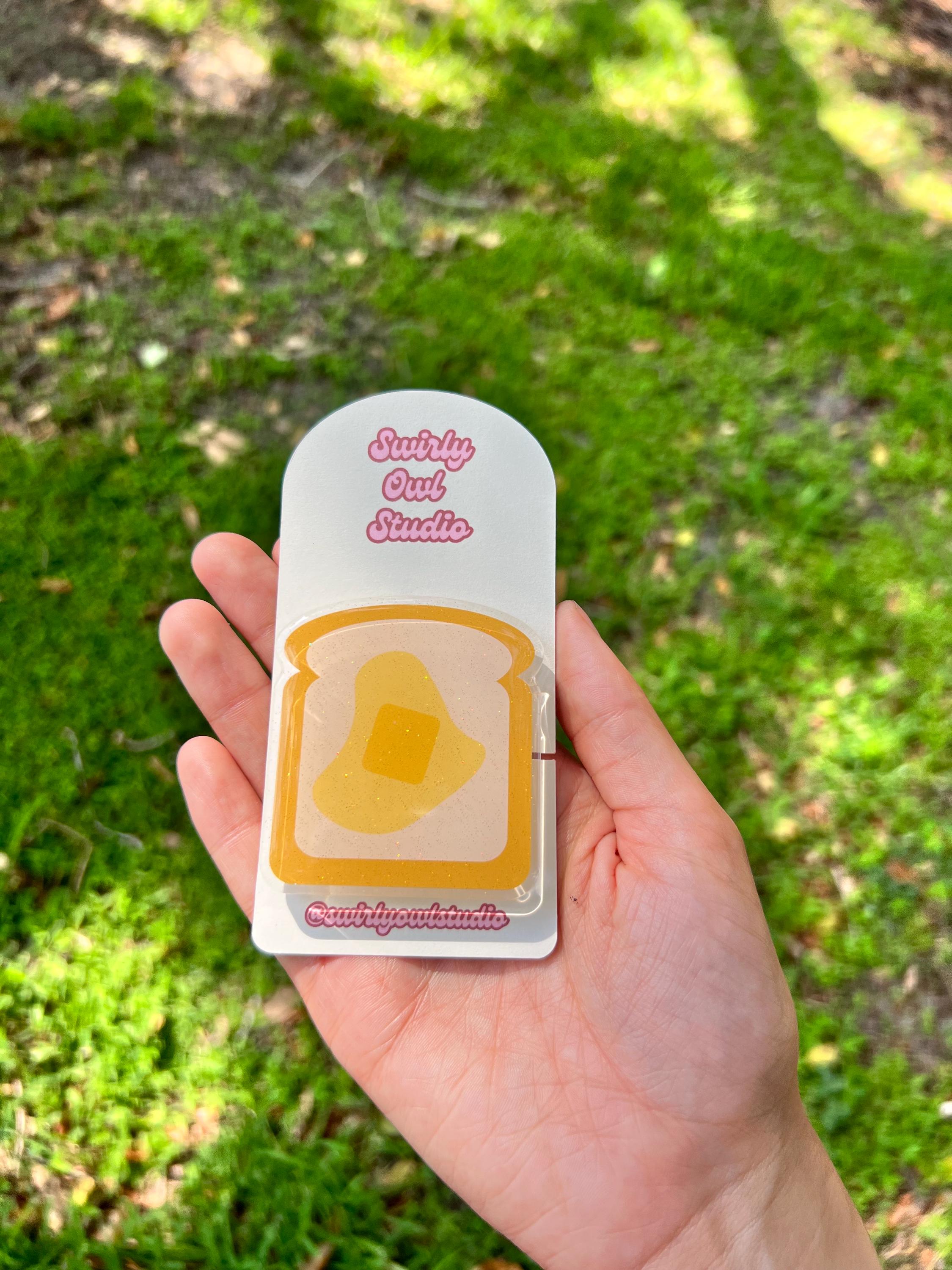 Buttered Toast Glitter Kindle/E-Reader Magnetic Grip - Cute Acrylic Phone Stand - Kawaii Food Phone Holder Gift for Bookish Lovers